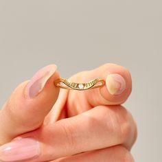 This 14k solid gold stacking ring boasts delicate moon phases engraved along the curve, adding celestial charm. Designed to complement small engagement rings, it's a perfect fit for those seeking simplicity and elegance. Choose from 14k, 18k, or 10k gold options in yellow, rose, or white, allowing you to customize your piece to perfection. Enhance your ring stack with this timeless lunar-inspired beauty. Features * Gold KT: 10K Solid Gold * Custom Gold Color: Yellow Gold, White Gold, Rose Gold * Delicate Stackable Engraved Ring For Anniversary, 14k Gold Crescent Jewelry For Promise Ring, 14k Gold Crescent Promise Ring, Anniversary Crescent Jewelry Engraved, Dainty Crescent Wedding Rings, Dainty Crescent Wedding Jewelry, Delicate Stackable Rings In Recycled Gold For Anniversary, Yellow Gold Crescent Rings For Promise, Delicate Recycled Gold Stackable Rings For Anniversary