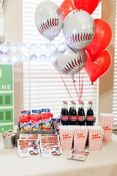 a baseball themed birthday party with balloons and snacks