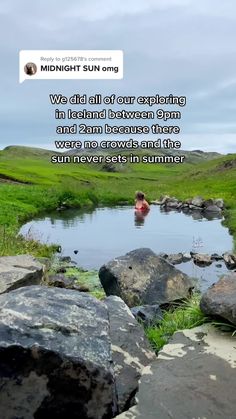 a man swimming in a river surrounded by rocks and grass with the text midnight sun on it