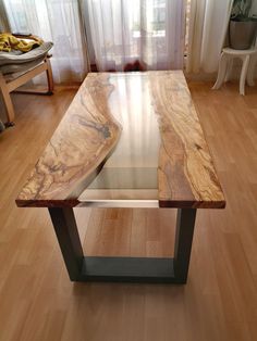 a wooden table sitting on top of a hard wood floor