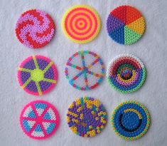 six crocheted circles are arranged on a white surface, each with different designs