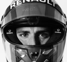 a man wearing a helmet with the words renault on it