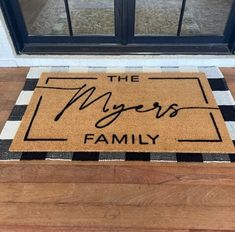 a door mat that says the myerss family on it in front of a window