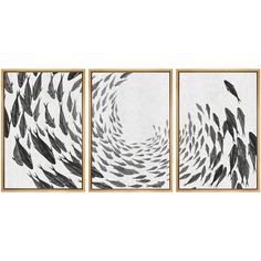 three black and white paintings hanging on a wall next to each other with fish swimming in the water