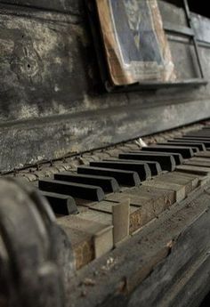 black and white photograph of an old piano