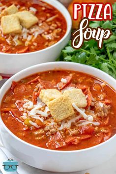 two bowls of pizza soup with bread croutons and parmesan cheese