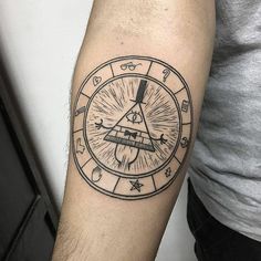 a man with a tattoo on his arm has a clock in the middle of it