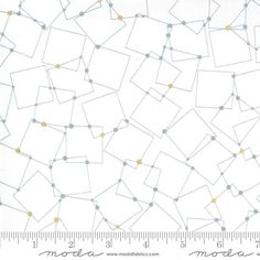 a ruler is next to a white background with yellow and gray dots on it,