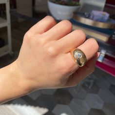 Who can say no to a chunky AF gold dome ring - let alone one with a bright and sparkly diamond? She’s a French little number in 18kt light rose gold - a sweet, pinky middle ground between yellow and rose. We adore the spread of this guy on one’s finger, it’s perfect for those who love a bolder, gold heavy vibe when it comes to their jewelry. The ring also has some patina that we love, but can be buffed out upon request.18kt light rose gold, size 7.25Diamond is estimated to be I/J color & VS clar Everyday Yellow Gold Diamond Signet Ring, Domed Yellow Gold Rings With Rose Cut Diamonds, Gold Dome Ring With Vs Clarity Diamond, Fine Jewelry Domed Dome Ring With Brilliant Cut, Gold Domed Ring With Brilliant Cut, 14k Gold Dome Ring With Vs Clarity, Oval Yellow Gold Diamond Dome Ring, Yellow Gold Dome Ring With Rose Cut Diamonds, Everyday Diamond Oval Signet Ring