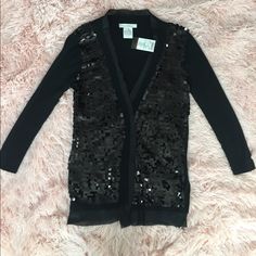 Stunning Sequin Cardigan Perfect For The Upcoming Holiday Season. Perfectly Adorned With Sequins All Over The Front, Bare On The Back And Sleeves, Shimmer Lining. Previously Sold At Metro Park And Anthropologie. New With Tags. Size Xs, 65% Cotton, 35% Spandex (So Plenty Of Stretch!) Bundle And Save!! Black Cardigan For Party In Fall, Casual Black Cardigan For Party, Black Spring Party Cardigan, Spring Party Black Cardigan, Fitted V-neck Cardigan For Parties, Chic Sequined Cardigan For Fall, Spring Fitted Sweater With Sequins, Fitted Spring Sweater With Sequins, Black V-neck Cardigan For Night Out