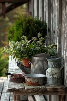 pots and pans are sitting on an old wooden table