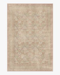 a beige rug with an intricate design on it