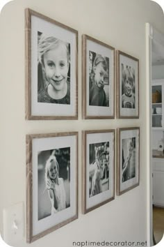 a wall with four pictures hanging on it