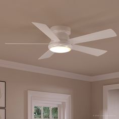 a white ceiling fan in a room