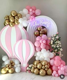 balloon decorations and balloons are arranged on a table