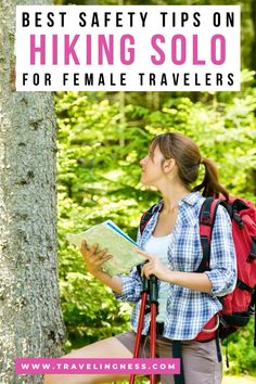 a female hiker looking at her map in the woods with text overlay reading best safety tips on hiking solo for female travelers