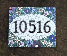 a mosaic tile with the number 2056 on it