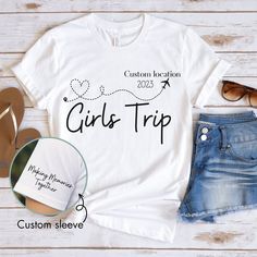 a t - shirt with the words girls trip on it next to some shoes and sunglasses