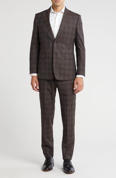 Classic notched lapels smarten the jacket of this trim-fit suit paired with flat-front trousers and finished in a handsome plaid print. 35 1/2" inseam; 10 1/2" rise (size 40R) Jacket has notched lapels; chest welt pocket; front flap pockets Unhemmed Lined 90% wool, 10% polyester Dry clean Imported Tailored Plaid Suit With Notch Lapel, Plaid Suits With Welt Pockets And Suit Collar, Plaid Single Breasted Suits For Business Casual, Fitted Plaid Suit With Welt Pockets, Plaid Notch Lapel Suit For Business Casual, Tailored Plaid Suits For Business Casual, Tailored Plaid Suits With Welt Pockets, Plaid Suits With Notch Lapel And Welt Pockets, Plaid Suit With Suit Collar For Work