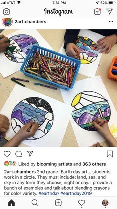 two children are making art with crayons and colored pencils