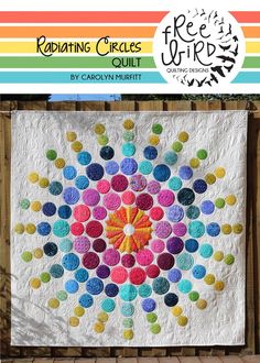 a colorful quilt hanging on the side of a fence with text reading radiating circles quilt