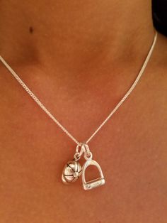 "Stirrup Horse Necklace, Helmet Pendant, Horse Sterling Silver, Stirrup Jewelry, Equestrian Necklace, Horse Necklace, Equestrian Jewelry * Sterling Silver * Stirrup Size is 3/8\" by 3/8\" * Helmet size is 1/4\" by 1/2\" * 16\" Sterling Silver Chain * 17\" Adjustable Black Cord We have recreated this fashioned in to our earrings and pendants. This is a link for helmet earrings: https://etsy.me/2mthFFE This is a link for stirrup earrings: https://etsy.me/2GYIlYG This is a link for helmet stud earr Horse Helmet, Equestrian Necklace, Equestrian Jewelry, Horse Necklace, Horse Jewelry, Horses Pendant, Jewelry Sterling Silver, Silver Pieces, Necklace Sterling Silver