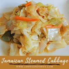 a white plate topped with cabbage and carrots