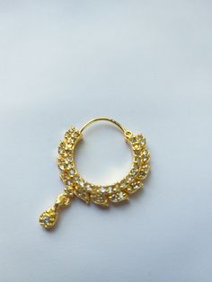 an image of a gold ring with diamonds