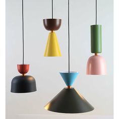 four different colored lamps hanging from strings