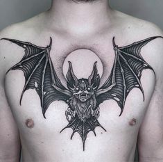 a man with a bat tattoo on his chest