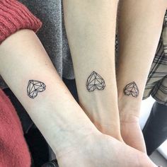 two people with matching tattoos on their arms