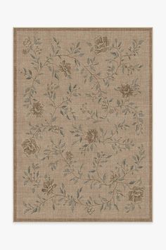 a beige rug with flowers and leaves on it