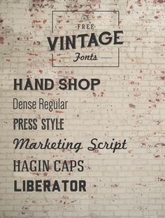 an old brick wall with the words vintage font and hand shop written in black on it