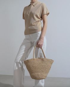 Beige raffia bag from The Row. The Emilie raffia bag is handwoven in natural raffia with top handles, a self-tie closure and dimensional texture.Measurements: L42 x H28 x W18 cmHandle drop: 45cmMade in Italy Chic Beige Crochet Bag With Woven Leather, Chic Beige Crochet Bag With Woven Leather Details, Natural Color Crochet Bag With Woven Leather, Natural Colored Crochet Bag With Woven Leather, Elegant Natural Straw Bag For Shopping, Elegant Natural Straw Shopping Bag, Chic Beige Shoulder Bag In Natural Fiber, Chic Beige Shoulder Bag With Natural Fiber, Chic Jute Straw Bag With Woven Leather