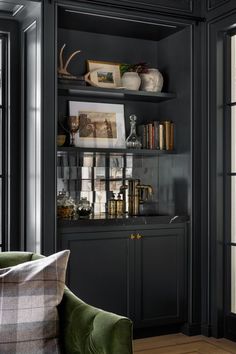 a living room filled with furniture and bookshelves