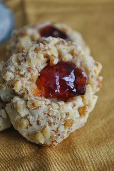 two cookies with jam on them sitting on a table