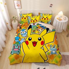 a bed room with a pokemon comforter and pillows