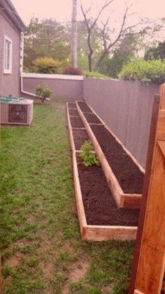 the garden is ready to be planted and put into the ground by the back yard