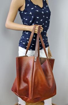 Brown large bag, Cognac brown owersized tote bag. Dimension details:Max width at the top: 60 cm / 23.6"Height: 35 cm / 13,5"Depth:25 cm / 10"Handle drop: 29 cm / 11,5" Brown Over sized city type bag.Adorable and very fashionable this season  large bag will make you feel special with her.A large, spacious bag for carrying books, laptops or shopping. The bag is so beautiful that you can just wear it empty, because it is soft and very pleasant in the end. The distressed leather's softened skin will Brown Tote-shaped Bucket Bag For Daily Use, Brown Bucket Tote Bag For Daily Use, Brown Tote Bucket Bag For Daily Use, Brown Bucket Bag For Shopping, Large Brown Bags With Double Handle, Cognac Tote Shoulder Bag For Shopping, Everyday Brown Shoulder Bag With Double Handle, Everyday Brown Double Handle Shoulder Bag, Brown Large Capacity Tote Bucket Bag