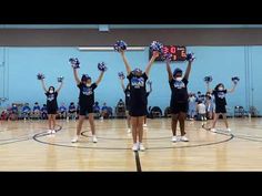 the cheerleaders are holding up their pom - poms in preparation to perform