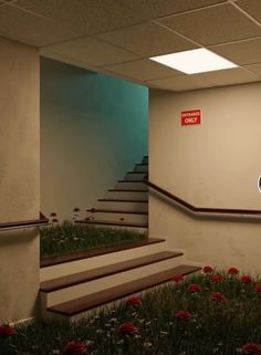 an empty room with stairs and flowers on the ground in front of a red sign