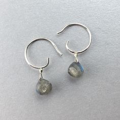 "These simple small sterling silver hoop earrings can go with any outfit. The faceted round Labradorite drops shimmer and reveals soft blue, gold, and green hues in the light. Each labradorite is about 8mm and the earrings drop length is about 1/2\" inch. An elegant design that makes the perfect gift for yourself or a loved one." Dainty Sterling Silver Hoop Earrings With Gemstone, Everyday Faceted Labradorite Jewelry, Minimalist Faceted Everyday Earrings, Minimalist Everyday Faceted Earrings, Everyday Briolette Sterling Silver Earrings, Adjustable Round Labradorite Earrings, Dainty Faceted Everyday Earrings, Dainty Faceted Sterling Silver Earrings, Everyday Labradorite Drop Earrings