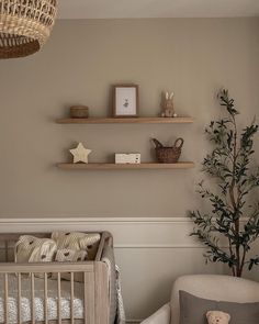 a baby's room is decorated in neutral colors