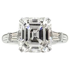 an emerald cut diamond ring with baguets