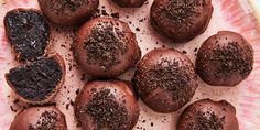 chocolate truffles on a pink plate with sprinkles