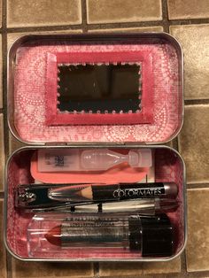 two containers with various makeup items in them on a tile floor next to each other