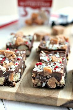 several pieces of chocolate candy bar on a cutting board