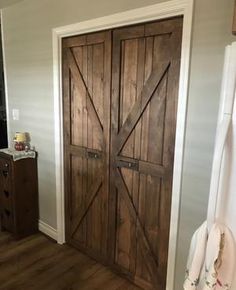 a large wooden door in the corner of a room