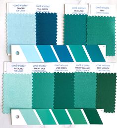 swatches of different shades of green and blue on a white table with text that reads cool winter colors