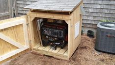 an outhouse with a generator and air conditioner in it